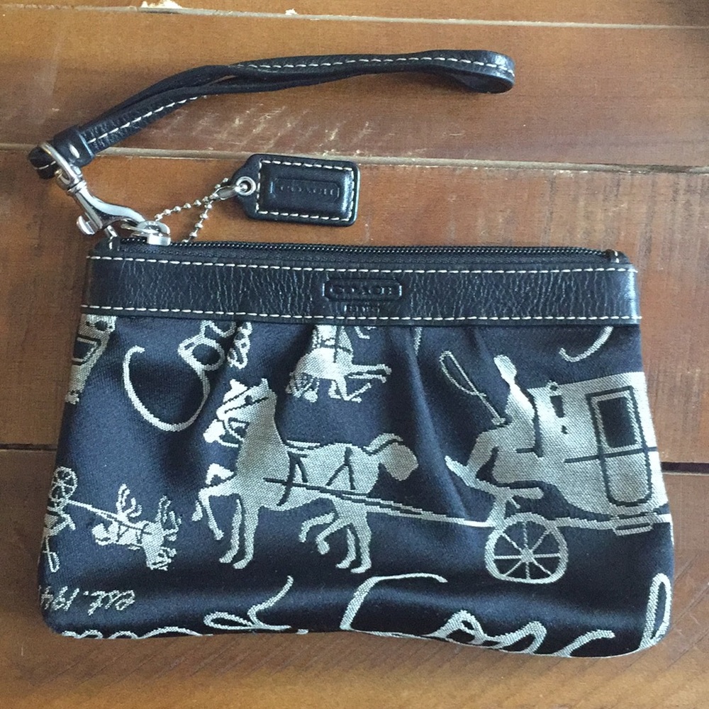 Black cloth Coach wristlet with horses and coach